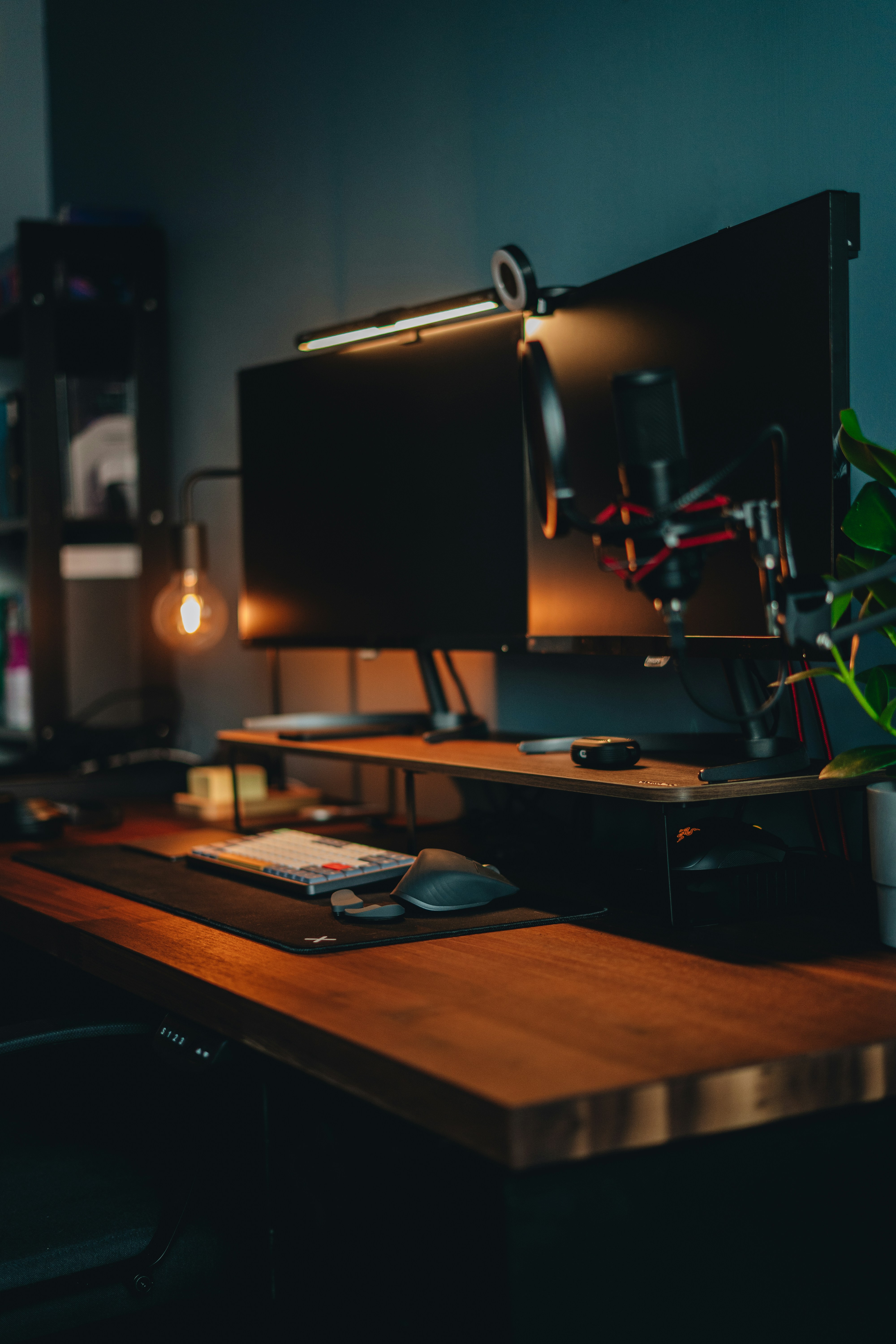 A designer's desk at night, lit by a warm bulb — the kind of considered space we build in